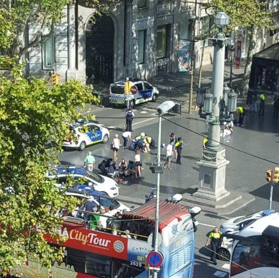  Police and emergency services attend to injured persons at the scene after a van crashed into pedestrians near the Las Ramblas avenue in central Barcelona