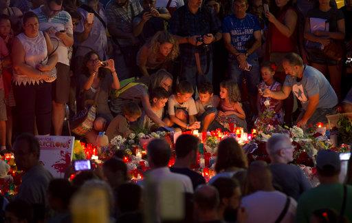 People Barcelona, flowers and candles at the site of the terrorist attack victims