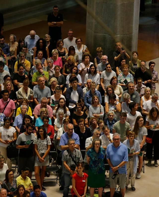 Members of the public attend a solemn Mass at Barcelona's Sagrada Familia Basilica for the victims.