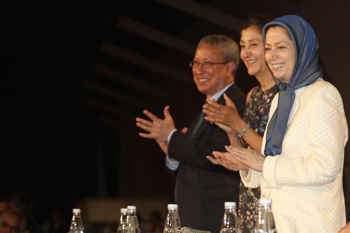 Maryam Rajavi and a number of dignitaries at a ceremoney marking the 29th anniversary of the 1988 massacre of political prisoner in Iran