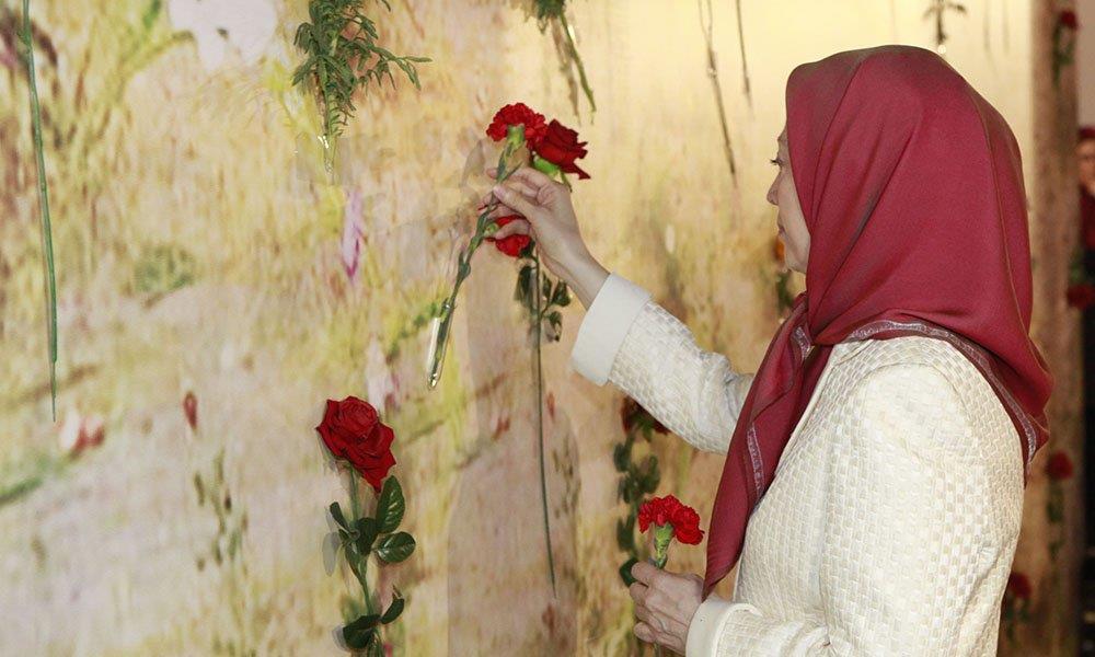 Mrayam Rajavi setting flowers at the memorial of the 1988 massacre of political prisoners in Iran