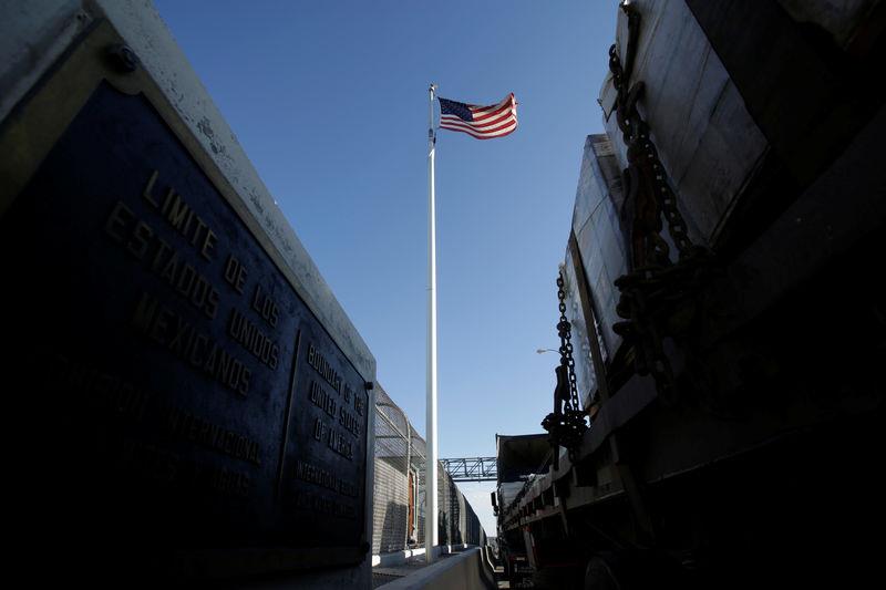 Trucks wait in the queue for border customs control to cross into U.S.