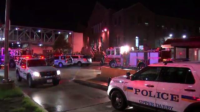  Police and Rescuers at the Scene of a Two-Train Crash in Philadelph