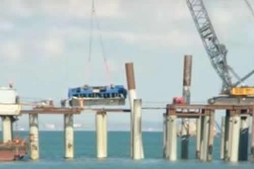 The bus has been lifted from the sea by a crane. At least 14 people have been killed in southern Russia