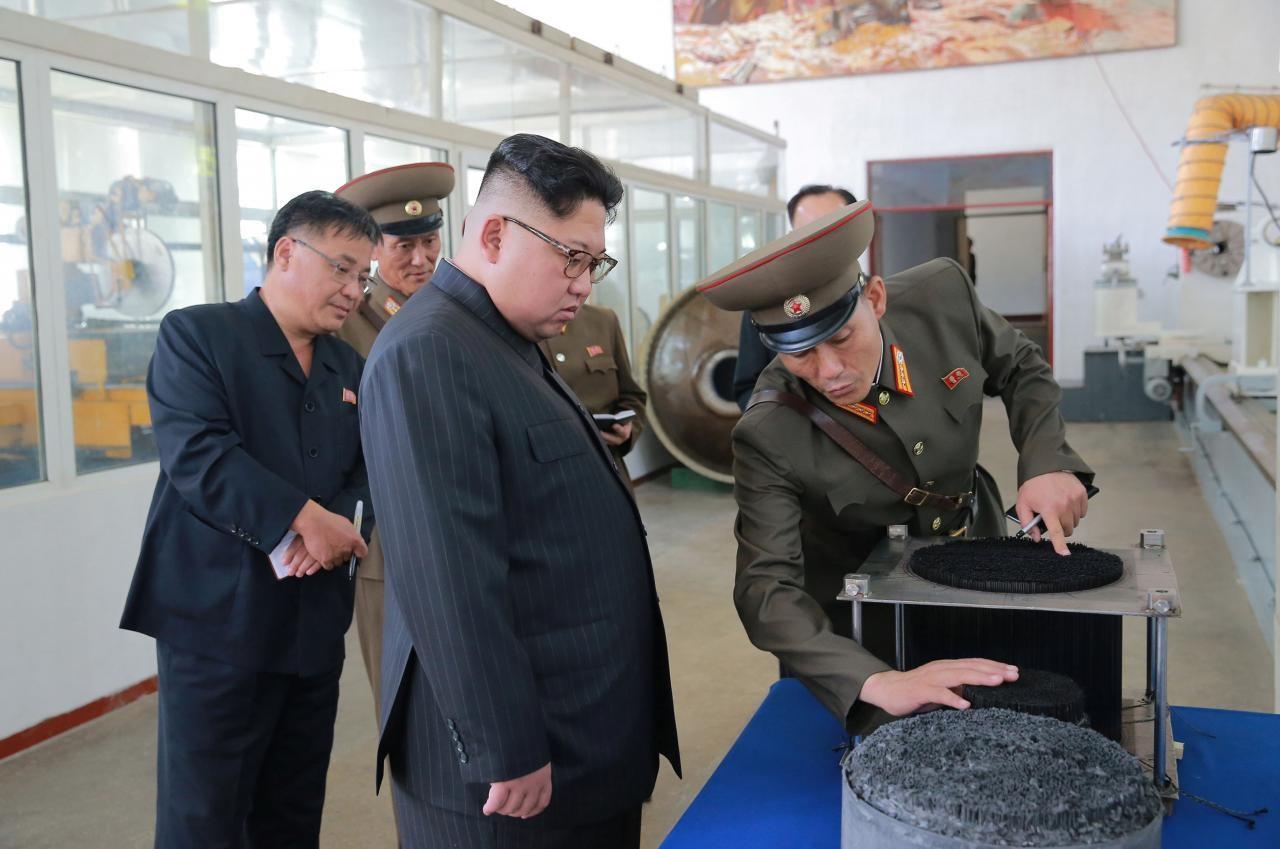 North Korean leader Kim Jong-Un looks on during a visit to the Chemical Material Institute of the Academy of Defense Science in this undated photo released by North Korea's Korean Central News Agency 