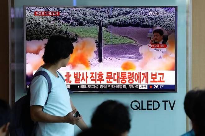 People watch a television broadcast reporting the North Korean missile launch at the Seoul Railway Station on Saturday in Seoul