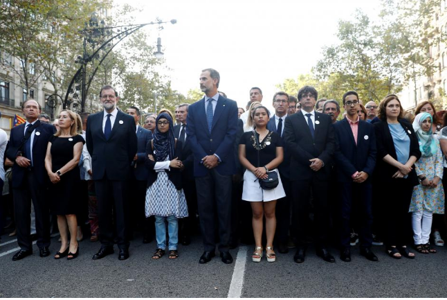 Spain's King Felipe (C), Prime Minister Mariano Rajoy (3rd L) and Catalan regional president Carles Puigdemont take part in a march of unity after the attacks last week, in Barcelona, Spain, August 26, 2017