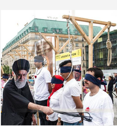 The demonstrators pose in a mock execution scene