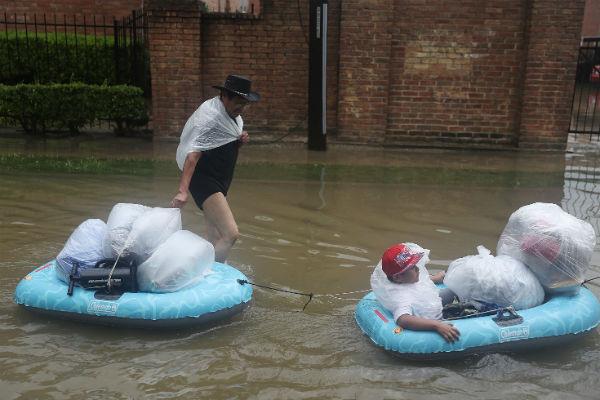  Houston residents used whatever means available to them to evacuate possessions and loved ones from the rising waters.