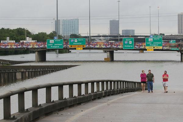 People view flooded highways in Houston on August 27, 2017