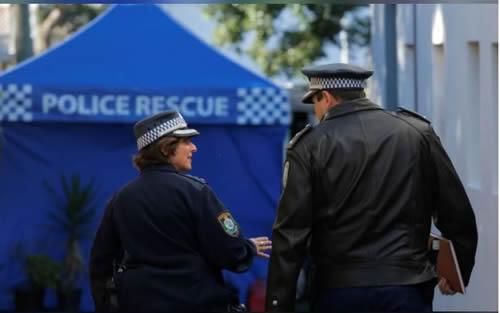 Senior Australian police officers arrive at a house in the Sydney suburb of Surry Hills, Australia, August 4, 2017 after raids in relation to a plot to attack a commercial aircraft.