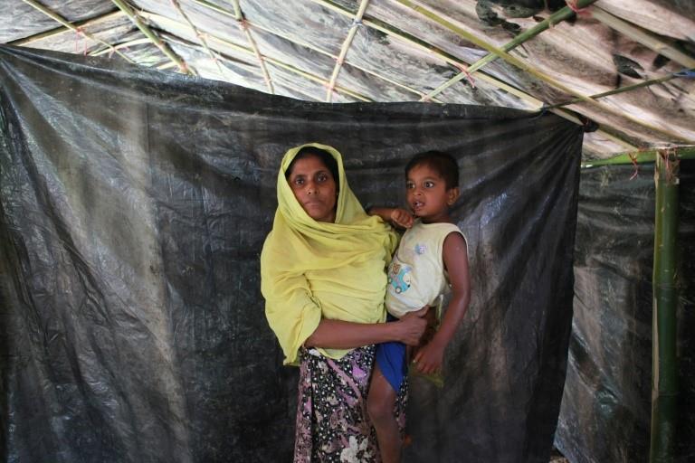  Anwara Begum said she plunged into a river with her four-year-old son, as soldiers fired at fleeing villagers