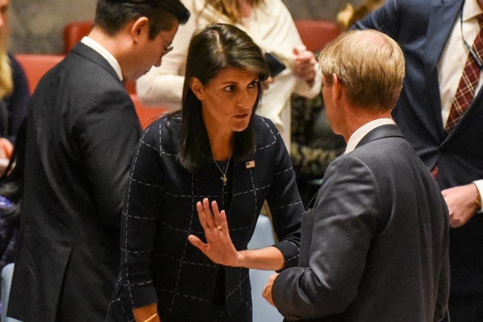 U.S. Ambassador to the UN, Nikki Haley speaks to another ambassador before a United Nations Security Council meeting on North Korea in New York City