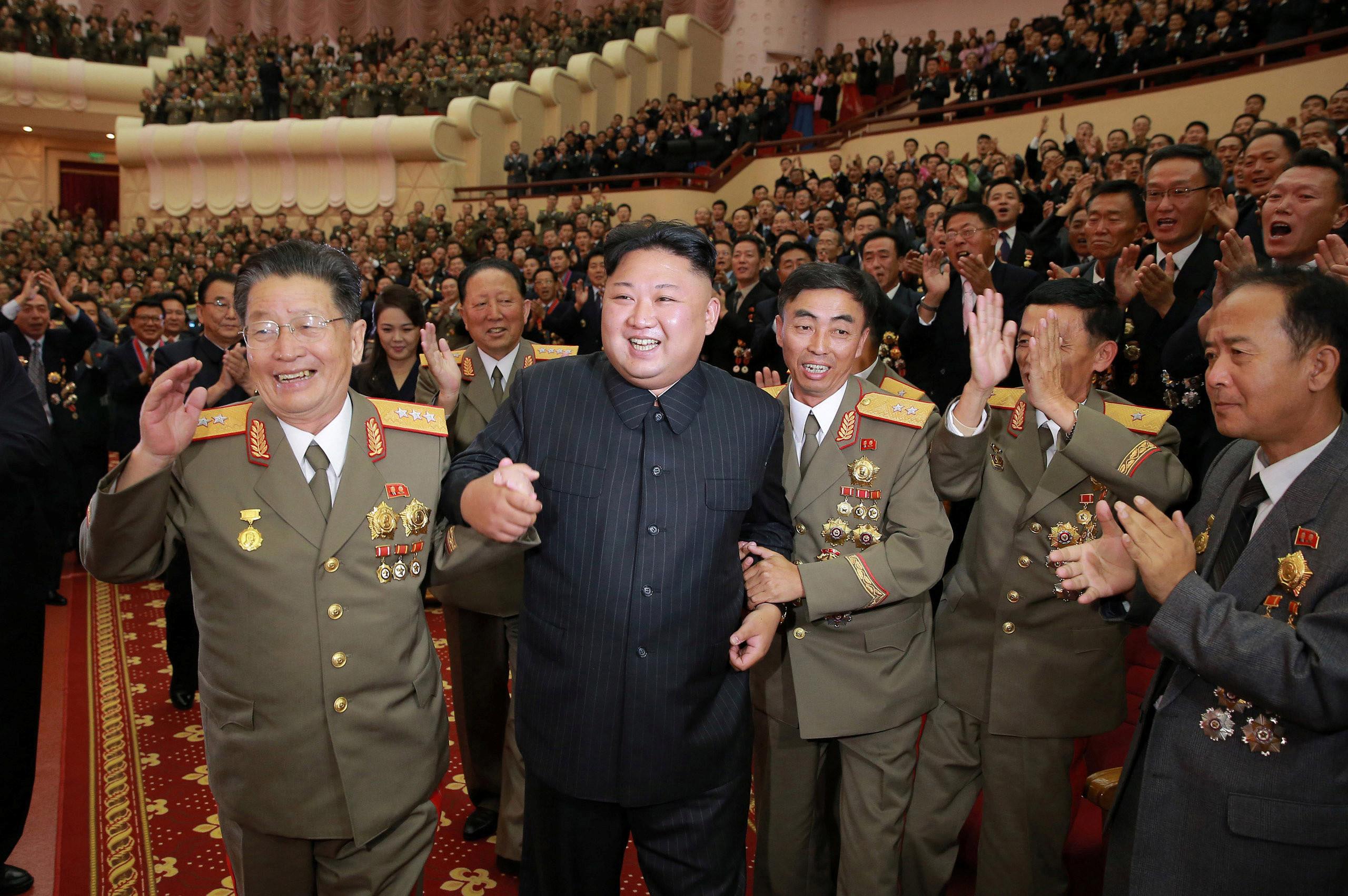 North Korean leader Kim Jong Un reacts during a celebration for nuclear scientists 