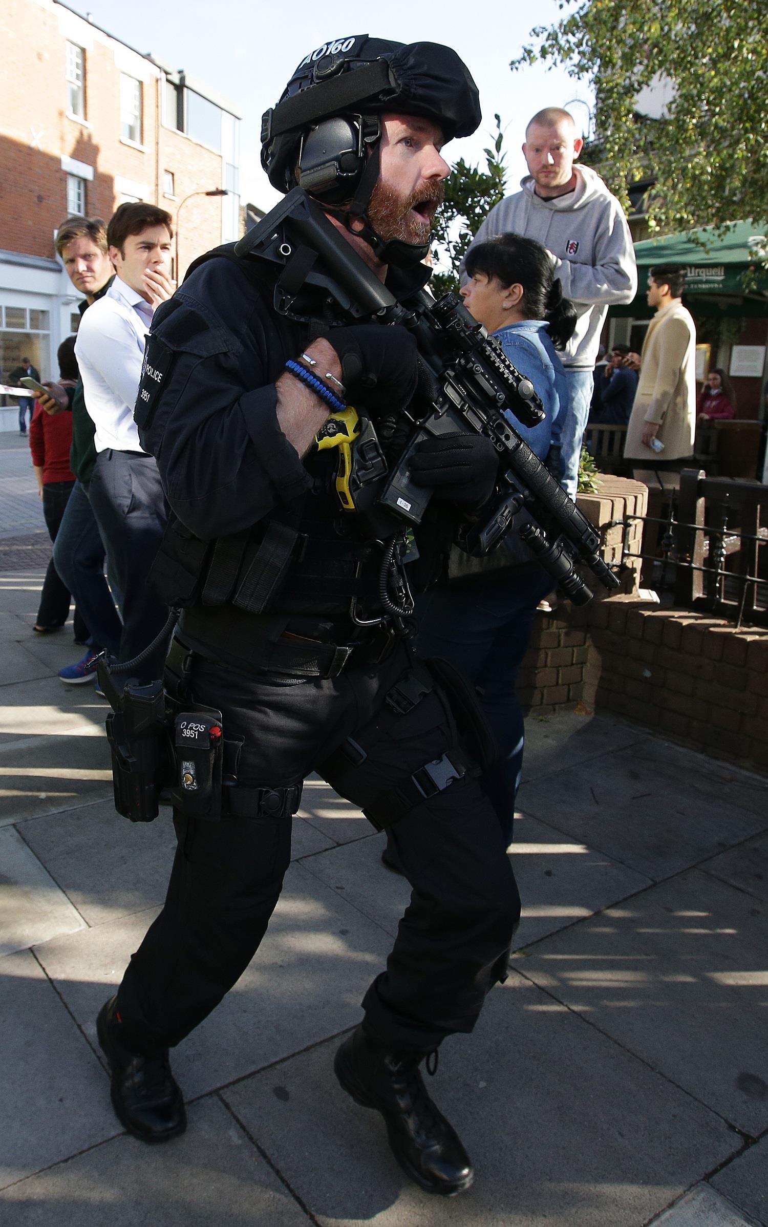 An armed British police officer works near Parsons Green underground tube station in west London on September 15, 2017