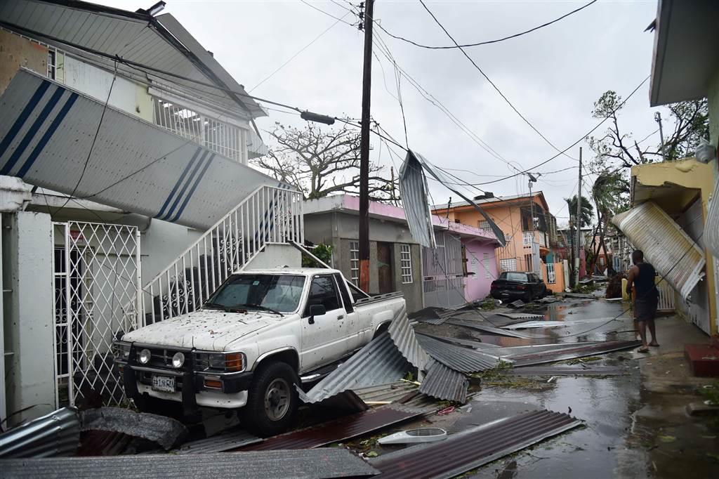 Debris litters a street in San Juan on Sept. 20.