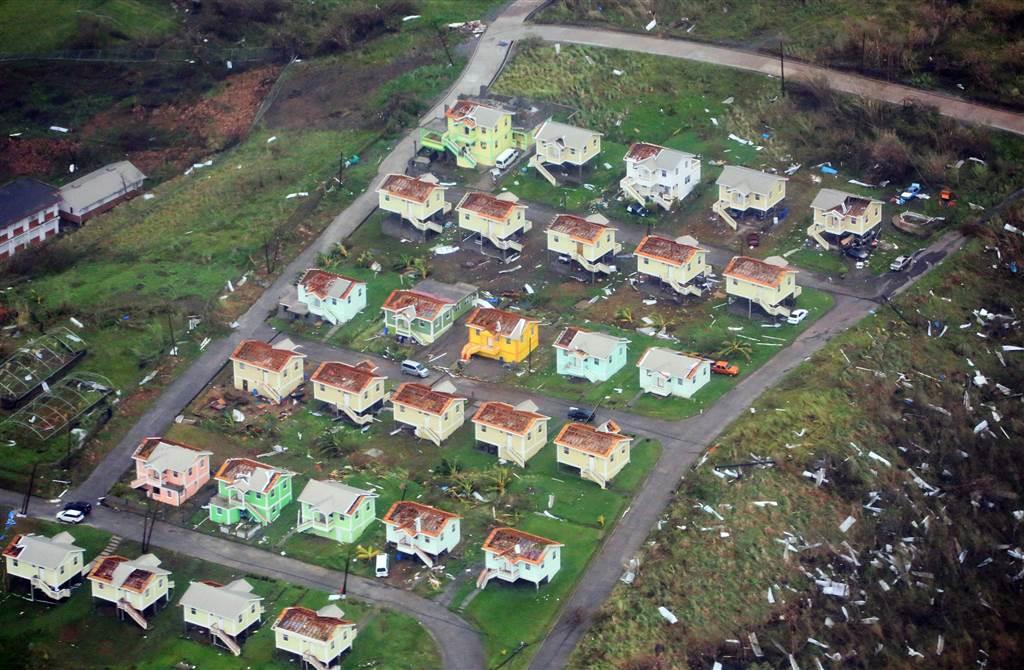 Roofs are stripped from houses after the passage of Hurricane Maria on the island of Dominica on Sept. 19. 