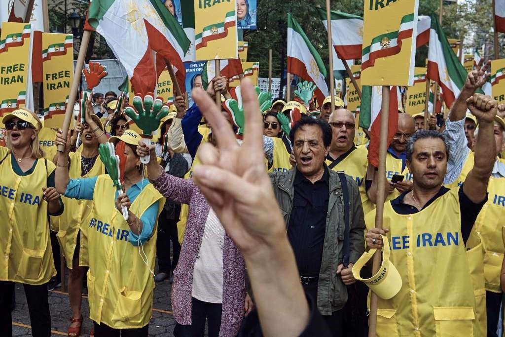  Protesters waved Iranian flags, chanted and held signs that said 'free Iran.'