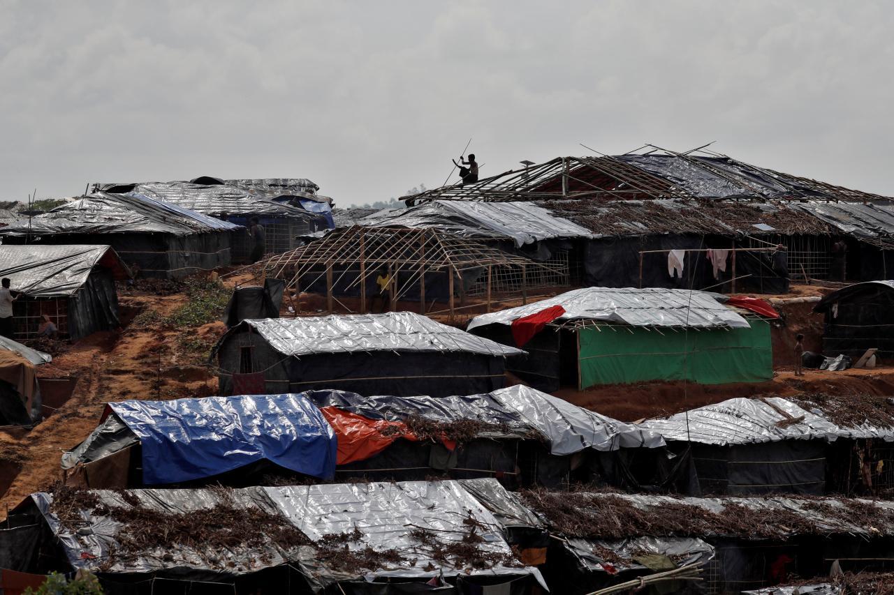 A Rohingya refugee builds a shelter in a camp in Cox's Bazar, Bangladesh, September 21, 2017