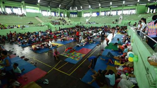 People wait inside an evacuation centre in Klungkung regency, on the Indonesian resort island of Bali on September 25, 2017