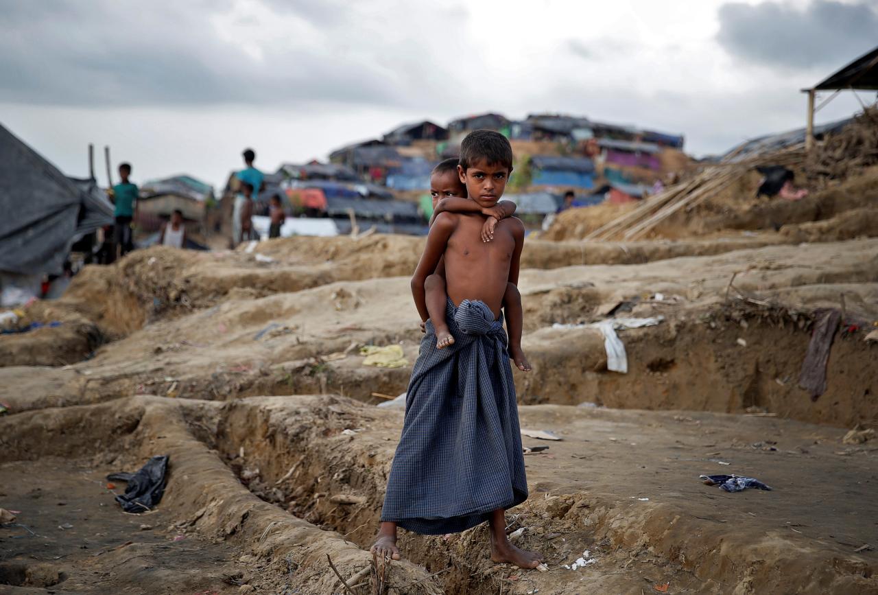 Rohingya refugee children pose for a picture in a camp at Cox's Bazar, Bangladesh, September 26, 2017