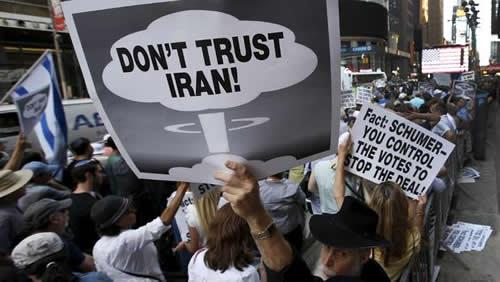 Demonstrators pack Times Square, shouting down with the recent accord and voicing their distrust of Iran