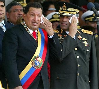 This file picture shows Venezuelan President Hugo Chavez (L) and Defense Minister Raul Isaias Baduel