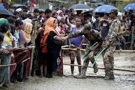 Rohingya refugees queue for aid in Cox's Bazar, Bangladesh, September 28, 2017