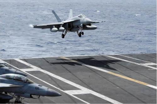 An F/A-18 Super Hornet lands on the deck of the USS Ronald Reagan in the South China Sea September 30, 2017. 
