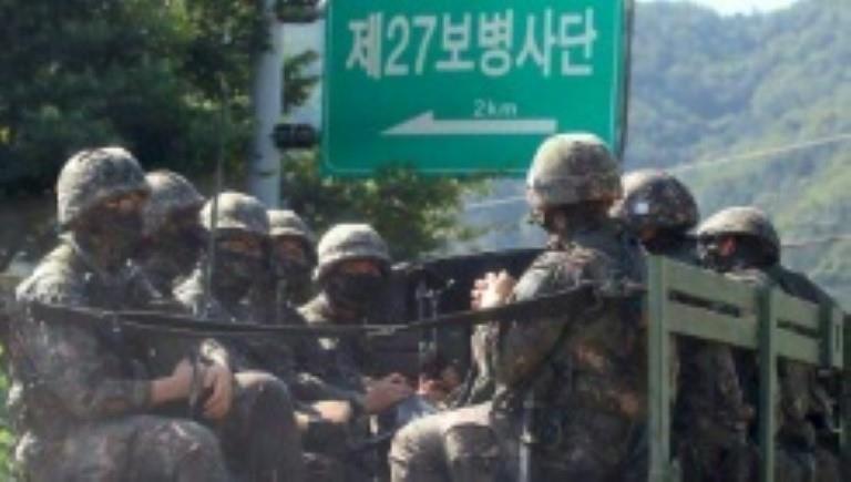 South Korean soldiers ride on a military truck in the border county of Hwacheon