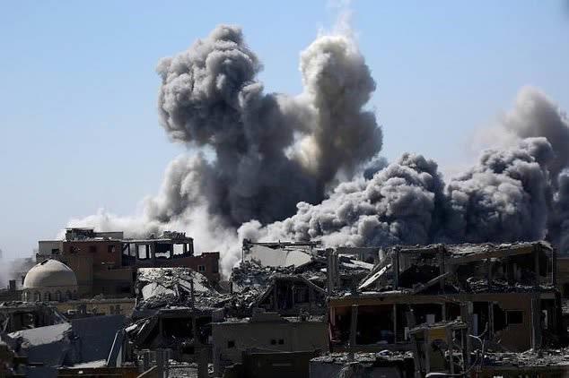 A US-led coalition air strike hits the Syrian city of Raqa on September 3, 2017, as the Syrian Democratic Forces alliance battles to oust the Islamic State group from its one-time Syrian bastion