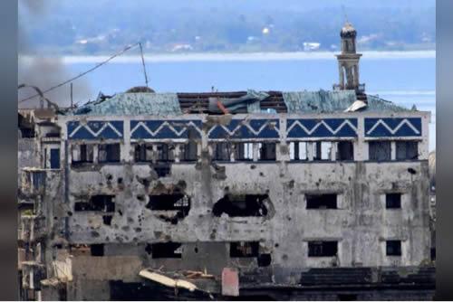 Damaged buildings and houses are seen as government troops continue their assault on its 105th day of clearing operations against pro-IS militants who have seized control of large parts of Marawi city, southern Philippines September 4, 2017