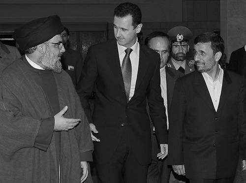 A SANA handout picture shows (L-R) Hassan Nasrallah, Syrian President Bashar al-Assad and his Iranian counterpart Mahmoud Ahmadinejad in Damascus on February 25, 2010.
