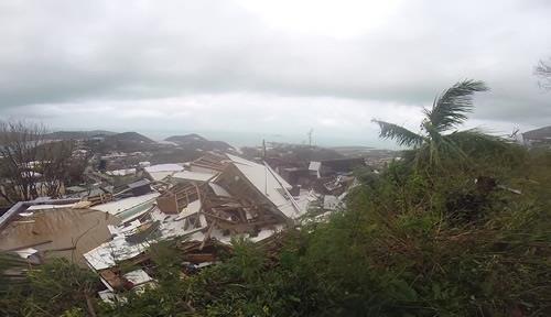 This image made from video shows several damaged houses by Hurricane Irma in St. Thomas, US Virgin Islands, on Thursday, Sept. 7, 2017.
