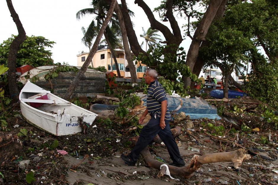  A man walks past boats lying on the seashore in the aftermath of Hurricane Irma in Puerto Plata, Dominican Republic, September 8, 2017