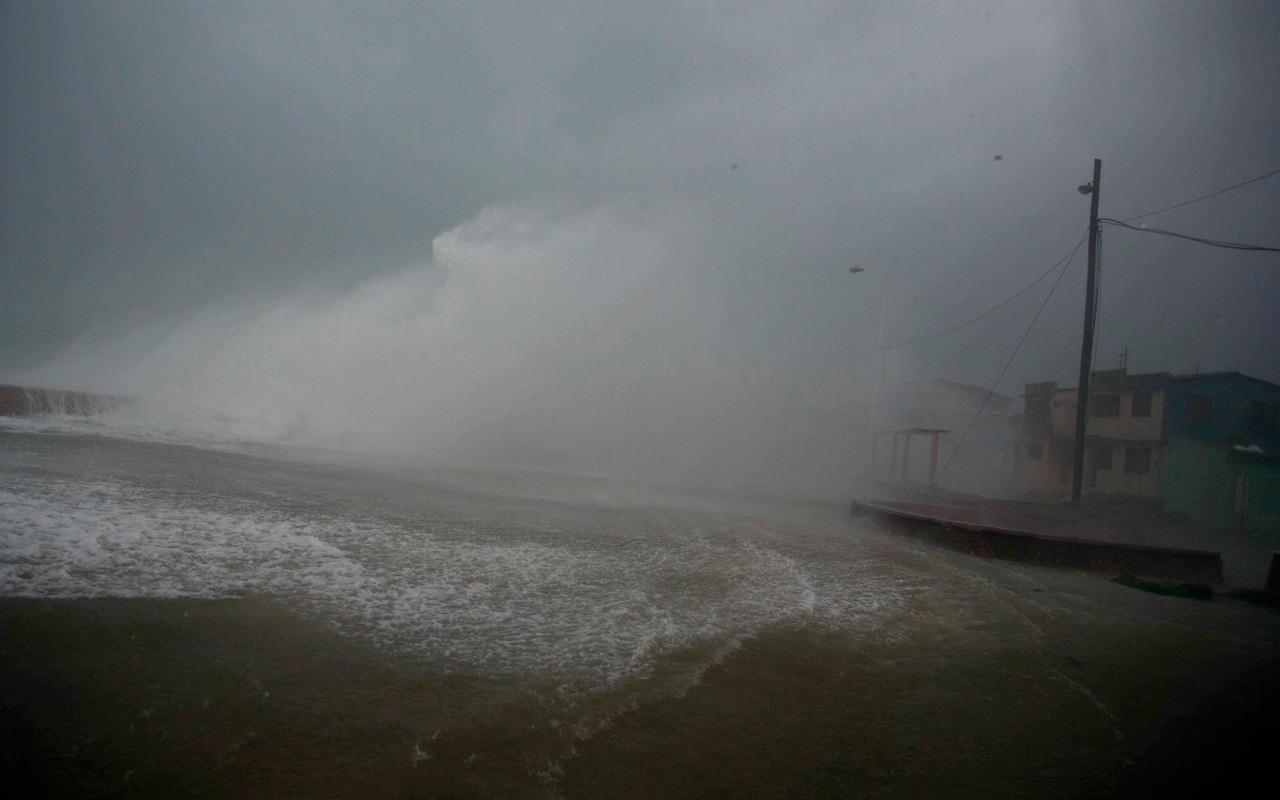 Surf and wind from Hurricane Matthew crash on the waterfront in Baracoa