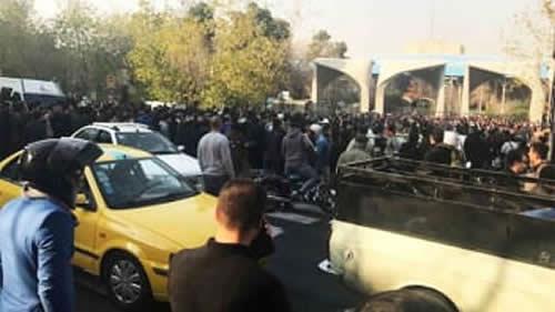 People protest near the university of Tehran on December 30, 2017 in this picture obtained from social media. 