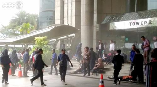 people outside of Indonesia's stock exchange after floor collapses