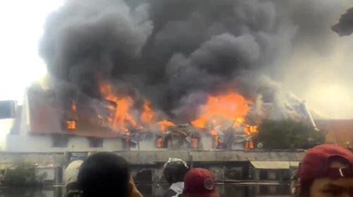 Smoke rises from a fire at the Maritime Museum in Jakarta, January, 16, 2018, in this still image taken from a social media video