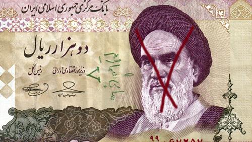 A 2,000 rial Iranian banknote showing Ayatollah Ruhollah Khomeini and a handwritten pro-opposition graffiti in Farsi. 