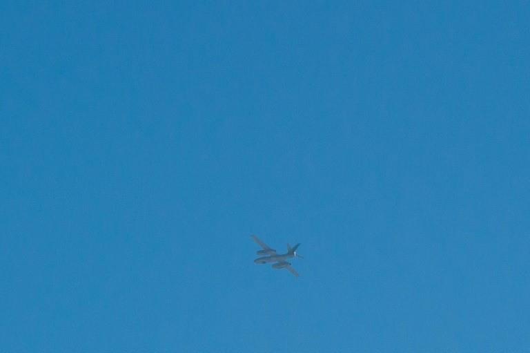 A light bomber flies over the North Korean town of Sinuiju 