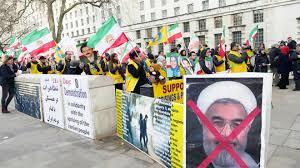 Iranian opposition groups hold a demonstration in support of protests in Iranian cities outside the prime minister's residence in London on Thursday.