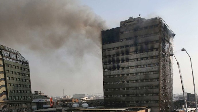 Smoke rises up from the Plasco building where firefighters work to extinguish a fire in central Tehran, Iran, January 19, 2017.
