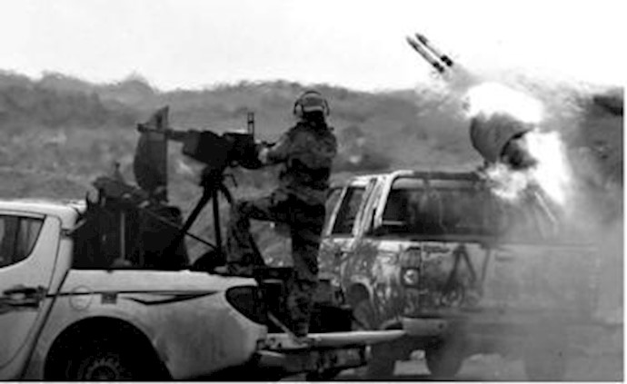 More Qaddafi officers defect as NATO steps up airstrikes