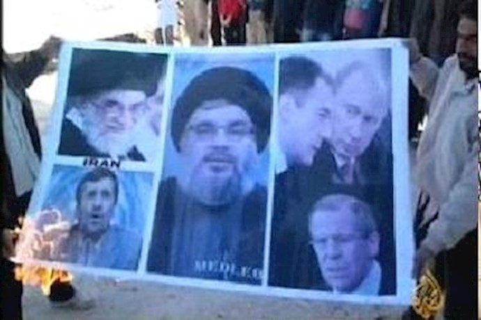 Syrian demonstrators set ablaze images of Khamenei, Assad supporters