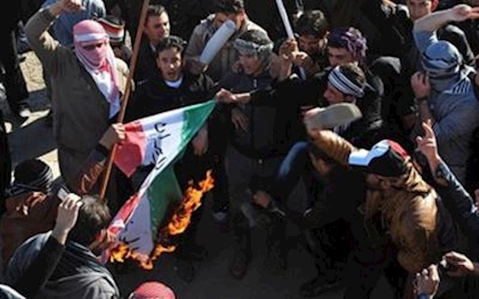 Anti-Maliki protesters in Iraq burn Iranian regime flag