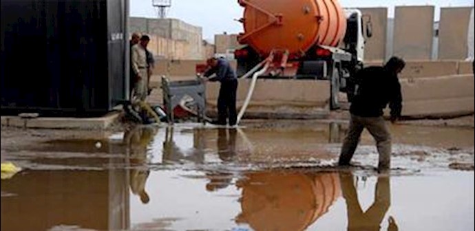  'Ashraf residents in Liberty attempting to clean up sewage water while Iraqi government not providing any assistance'