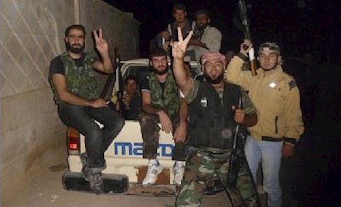 Twin blasts hit top Syrian army building in Damascus as West turns up heat on Assad