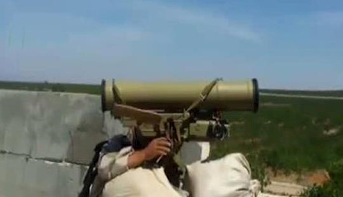  'Syrian rebels in action using TOW anti-tank missiles'