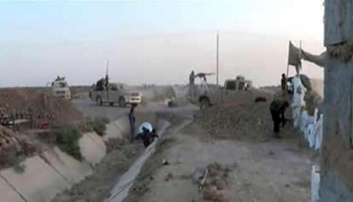  'Scene of Iraqi rebel forces attacking Maliki militant convoy'